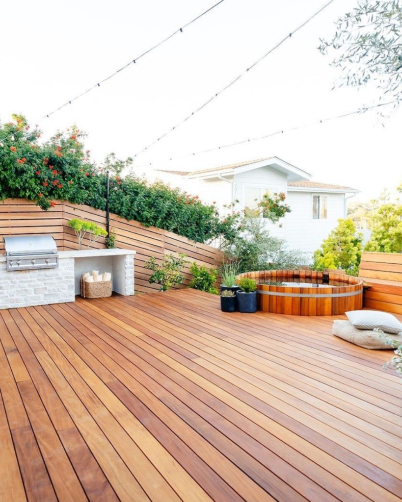 Cumaru hardwood deck with hot tub and built-in grill in San Francisco backyard outdoor living space