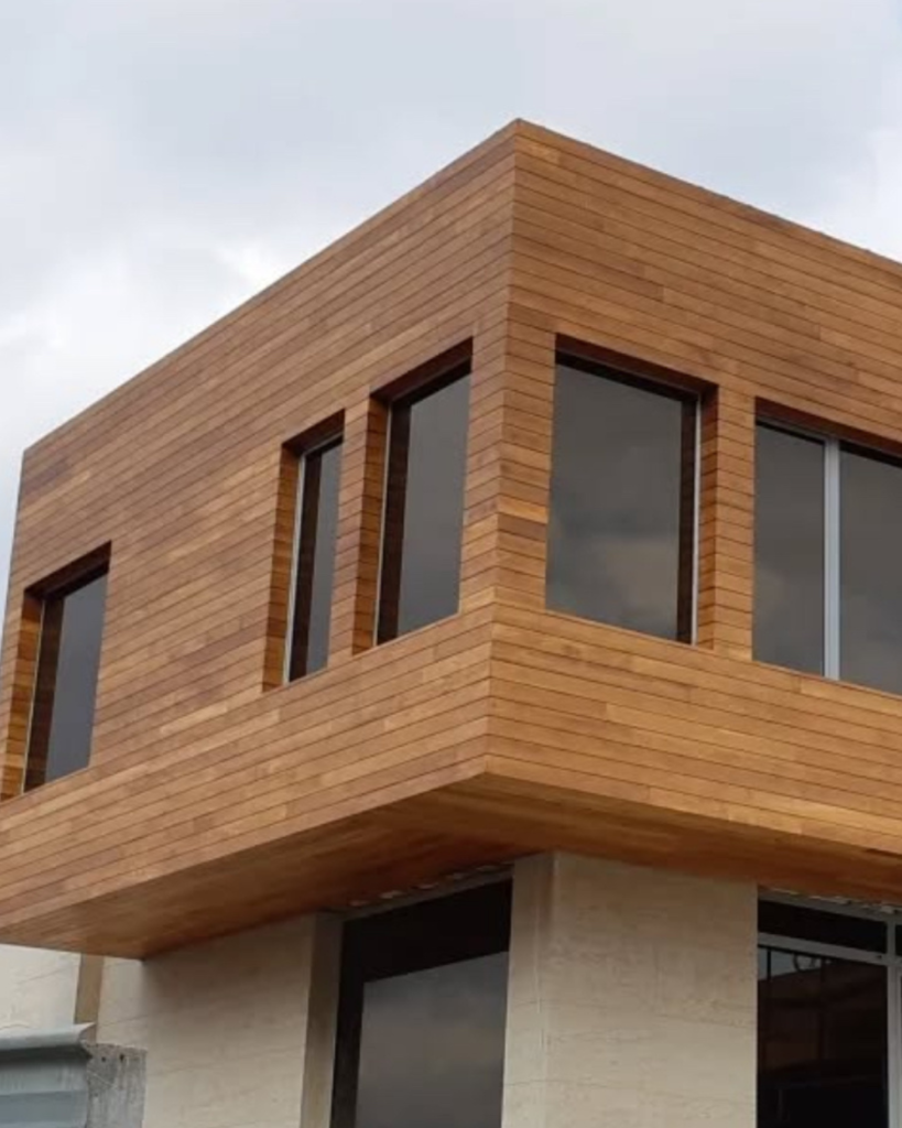 Cumaru wood cladding on modern residential facade with large windows in San Francisco