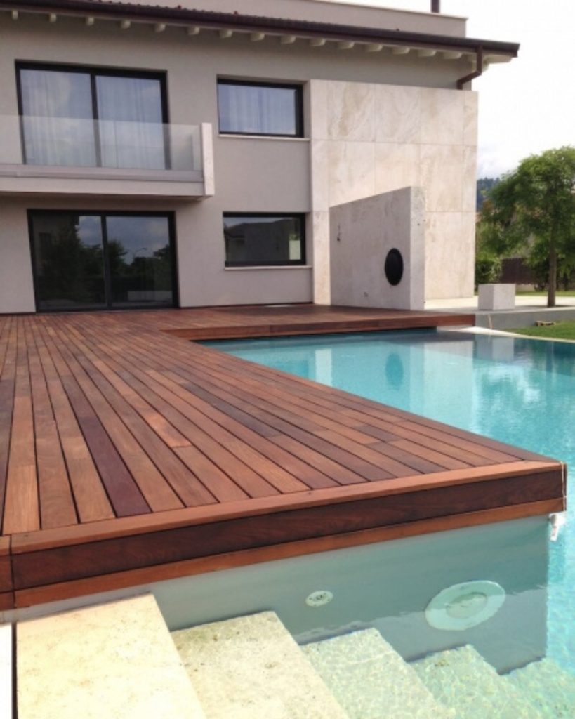 Modern Ipe wood deck surrounding a luxury swimming pool in San Francisco residential backyard